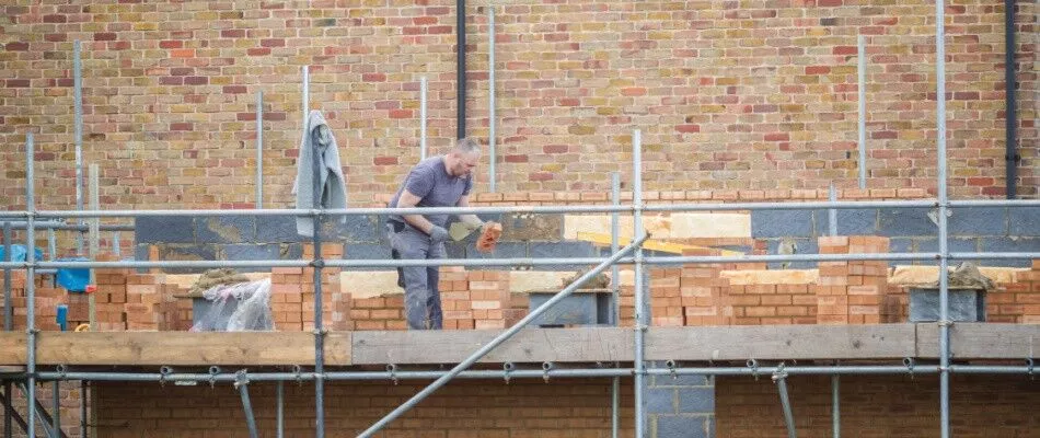 A man is working on a construction site.