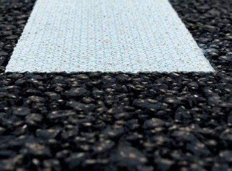 A road with a white and black stripe on it.
